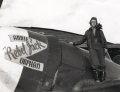 Quentin. C. Aanenson on the wing of his P-47 "Rebel Jack"